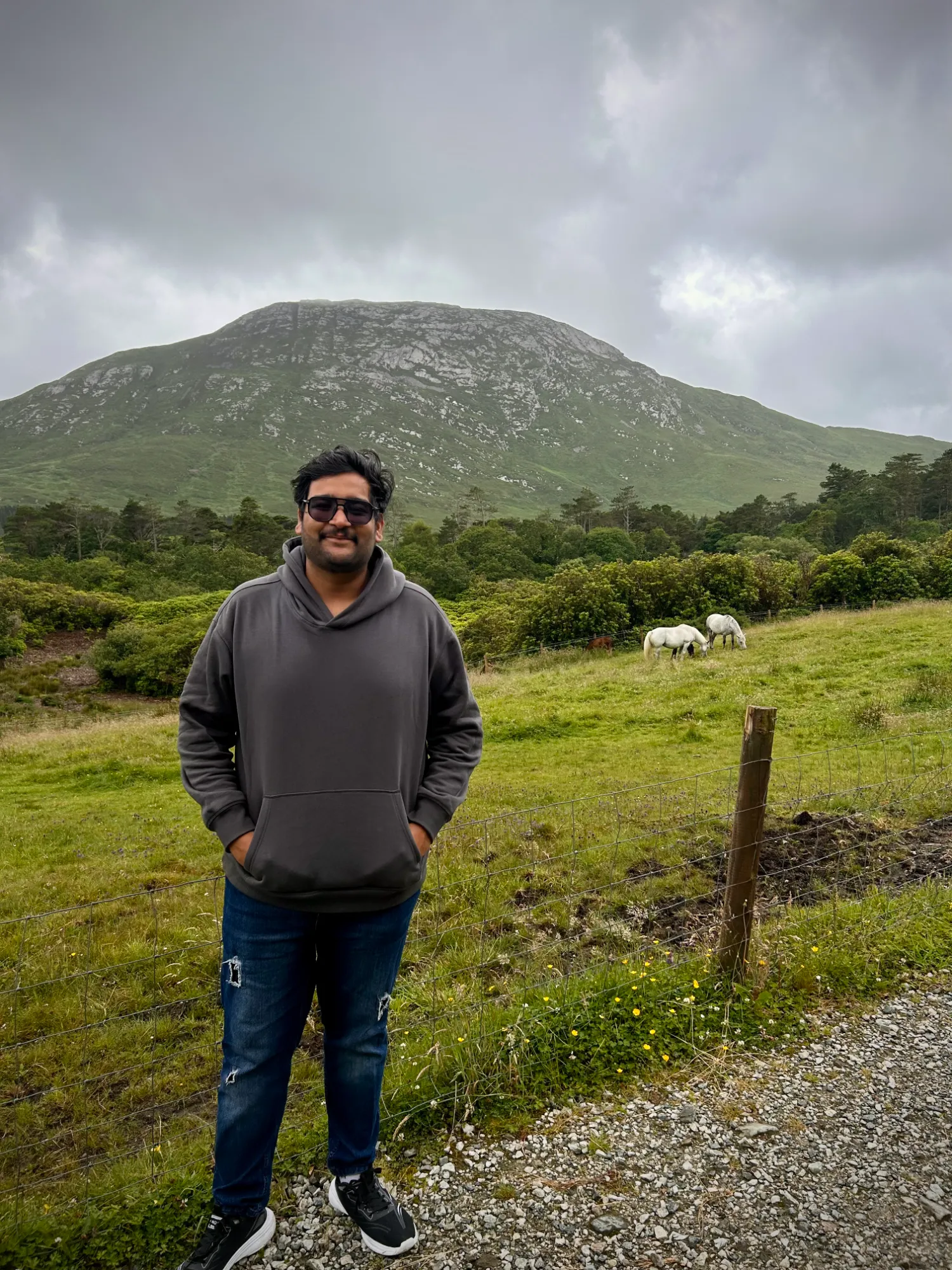 Anirudh Chugh in the Irish countryside with mountains behind
